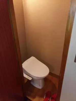 a bathroom with a white toilet in a stall at Hotel Edoya in Tokyo