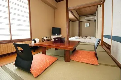 a room with a desk and a bunk bed at Hotel Edoya in Tokyo