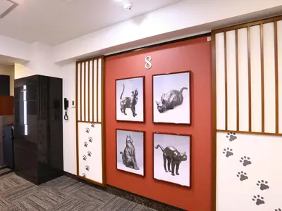 a room with pictures of animals on the wall at KOKO HOTEL Ueno Station - formerly Hotel Wing International Select Ueno Okachimachi in Tokyo