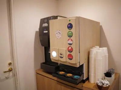 a coffee machine sitting on top of a table at KOKO HOTEL Ueno Station - formerly Hotel Wing International Select Ueno Okachimachi in Tokyo