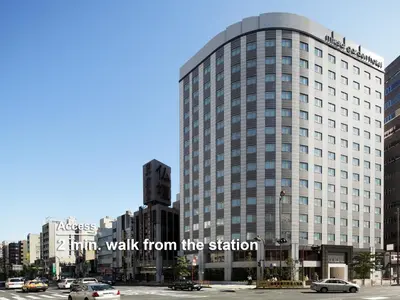 a tall building with the words walk from the station at Mitsui Garden Hotel Ueno in Tokyo