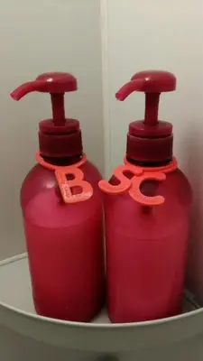 two red fire hydrants sitting on a shelf at Base Inn Tabata in Tokyo