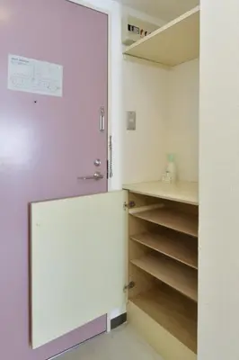 a walk in closet with a mirror and shelves at Refre Forum in Tokyo