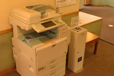 a stack of boxes sitting on top of a desk at Refre Forum in Tokyo