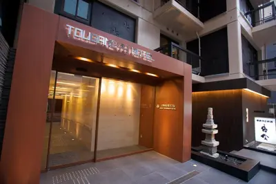 a facade of a building with a glass door at Ueno Touganeya Hotel in Tokyo