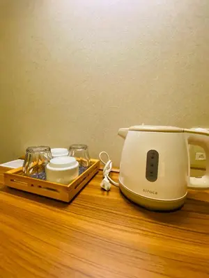 a toaster sitting on a table with a tray of food at Ueno Touganeya Hotel in Tokyo