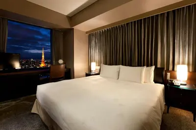 a hotel room with a large bed and a window at The Royal Park Hotel Iconic Tokyo Shiodome in Tokyo
