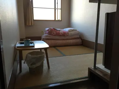 a small room with a table and a table sidx sidx sidx at Asakusa Hotel Fukudaya in Tokyo