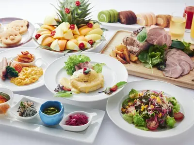 a table full of plates of food with different foods at Lotte City Hotel Kinshicho in Tokyo