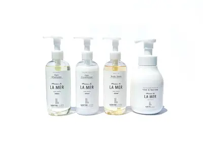 a group of four bottles of li water on a shelf at Lotte City Hotel Kinshicho in Tokyo