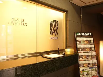 a counter in a store with a sign on it at HOTEL LiVEMAX BUDGET Higashi Ueno in Tokyo