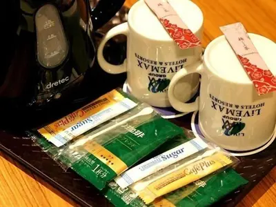 a tray of toothbrushes and two cups of coffee at HOTEL LiVEMAX BUDGET Korakuen in Tokyo