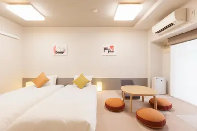 a bedroom with a bed and a table at Tokyu Stay Meguro Yutenji in Tokyo