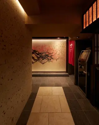 a hallway with a painting on the wall in a room at Sakura Sky Hotel in Tokyo