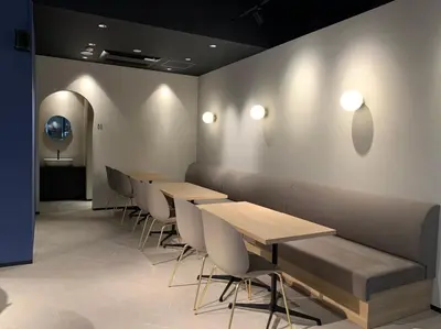 a row of tables and chairs in a room at Sotetsu Fresa Inn Ueno-Okachimachi in Tokyo