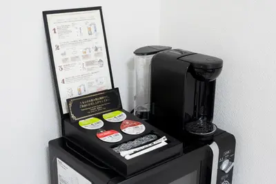 a coffee maker sitting on top of a counter at G-stays Shinjuku in Tokyo