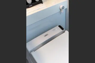 a drawer with a remote control on top of it at G-stays Shinjuku in Tokyo
