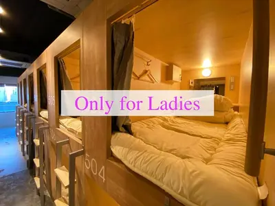 a room with bunk beds with a sign that reads only for ladies at TOKYO-W-INN Asakusa in Tokyo