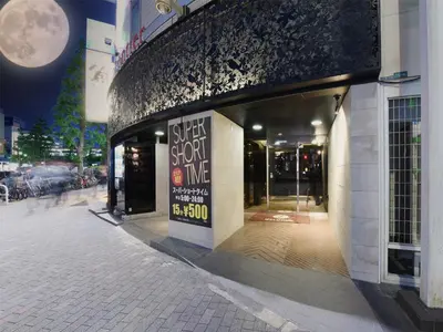 a store with a sign on the side of a building at Restay Frontier (Adult Only) in Tokyo
