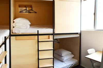 a room with two bunk beds and a bed at Tokyo Tower View Guest House in Tokyo