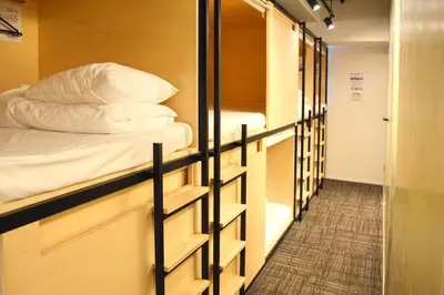 a row of bunk beds in a dorm room at Tokyo Tower View Guest House in Tokyo