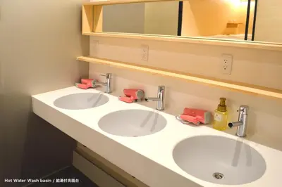 two white sinks in a bathroom with a mirror at Tokyo Tower View Guest House in Tokyo