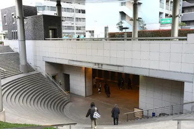 a group of people walking inside of a building at Tokyu Stay Yoga in Tokyo