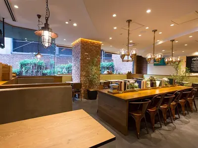 a restaurant with a bar with chairs and tables at Shibuya Tobu Hotel in Tokyo