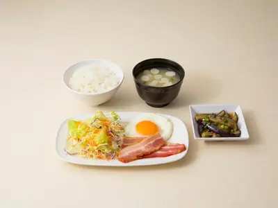 a table with a plate of food with rice and eggs at Shibuya Tobu Hotel in Tokyo