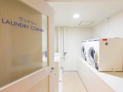 a laundry room with a washer and dryer at Shibuya Tobu Hotel in Tokyo