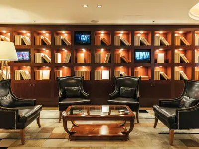 a lobby with leather chairs and a coffee table at Shibuya Tobu Hotel in Tokyo