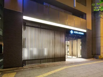 an entrance to a building with a sign on it at HOTEL MYSTAYS Kanda in Tokyo