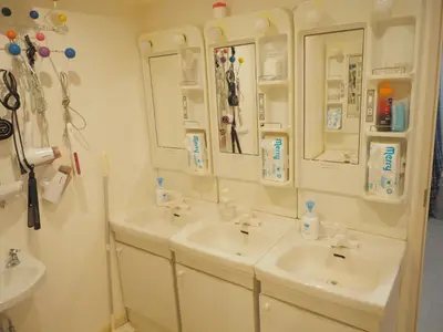 a bathroom with two sinks and two mirrors at bnb+ Akihabara (Female Only) in Tokyo