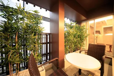 a balcony with a table and chairs and plants at The Centurion Classic Akasaka in Tokyo