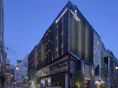 a large building on a city street at night at The Centurion Classic Akasaka in Tokyo