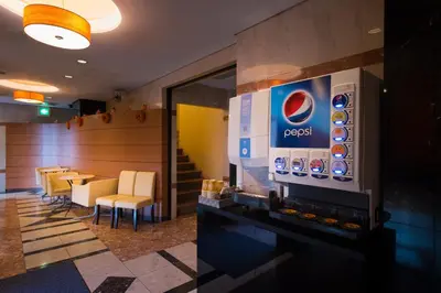 a dining room with a table and a television at Hotel Crest Kinshicho (Adult Only) in Tokyo