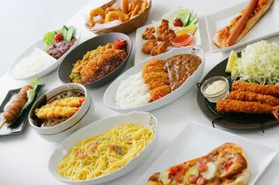 a table full of plates of food with different foods at Hotel Crest Kinshicho (Adult Only) in Tokyo