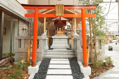 an orange torii gate in front of a building at Sotetsu Fresa Inn Tokyo Kinshicho in Tokyo
