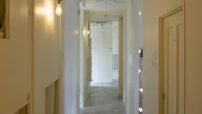 a hallway with a hallway leading into a room at almond hostel & cafe Shibuya in Tokyo