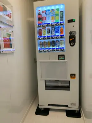 a vending machine with drinks in a room at Tokyo Ueno New Izu Hotel in Tokyo
