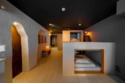 a room with a fireplace with a bed in it at AET & o3 HOTEL in Tokyo