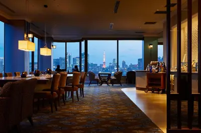 a restaurant with a view of a city skyline at Royal Park Hotel in Tokyo