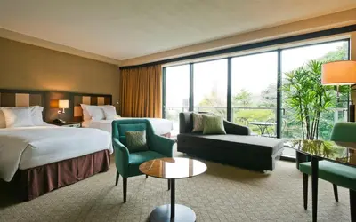 a hotel room with a bed and a couch at Sheraton Miyako Hotel Tokyo in Tokyo