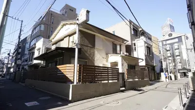 a house on the side of a street at House Ikebukuro in Tokyo