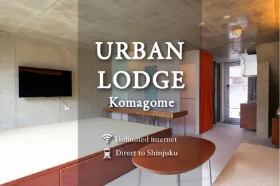 a living room with a table and a sign that reads urban lodge korea at URBAN LODGE Komagome in Tokyo