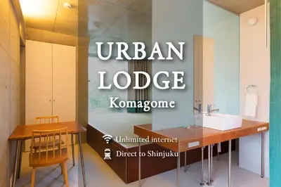 a bathroom with a counter and a sink in a room at URBAN LODGE Komagome in Tokyo