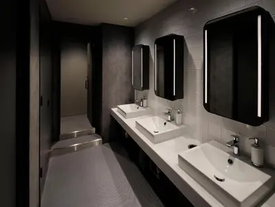 a bathroom with two sinks and two mirrors at The Millennials Shibuya in Tokyo