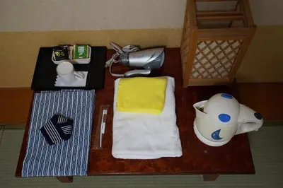 a toy table with a towel and a phone and a blender at Annex Katsutaro Ryokan in Tokyo