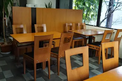 a dining room with wooden tables and chairs at Annex Katsutaro Ryokan in Tokyo