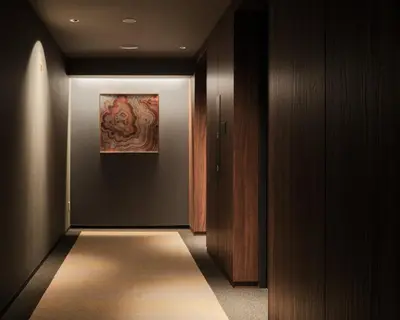 a hallway with a painting on the wall at Nest Hotel Tokyo Hanzomon in Tokyo